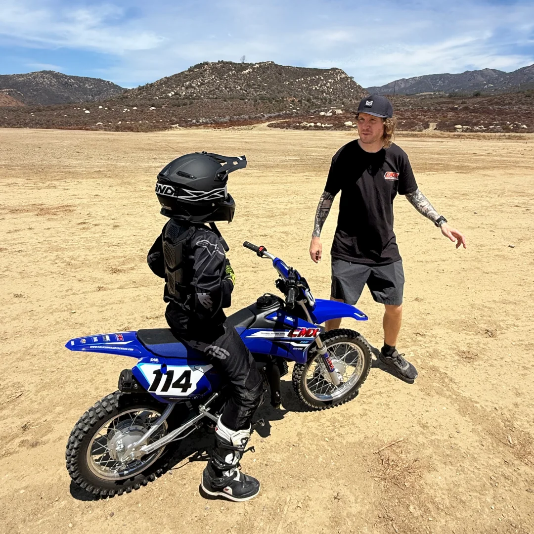 CMX instructor and student with a Yamaha beginner dirt bike