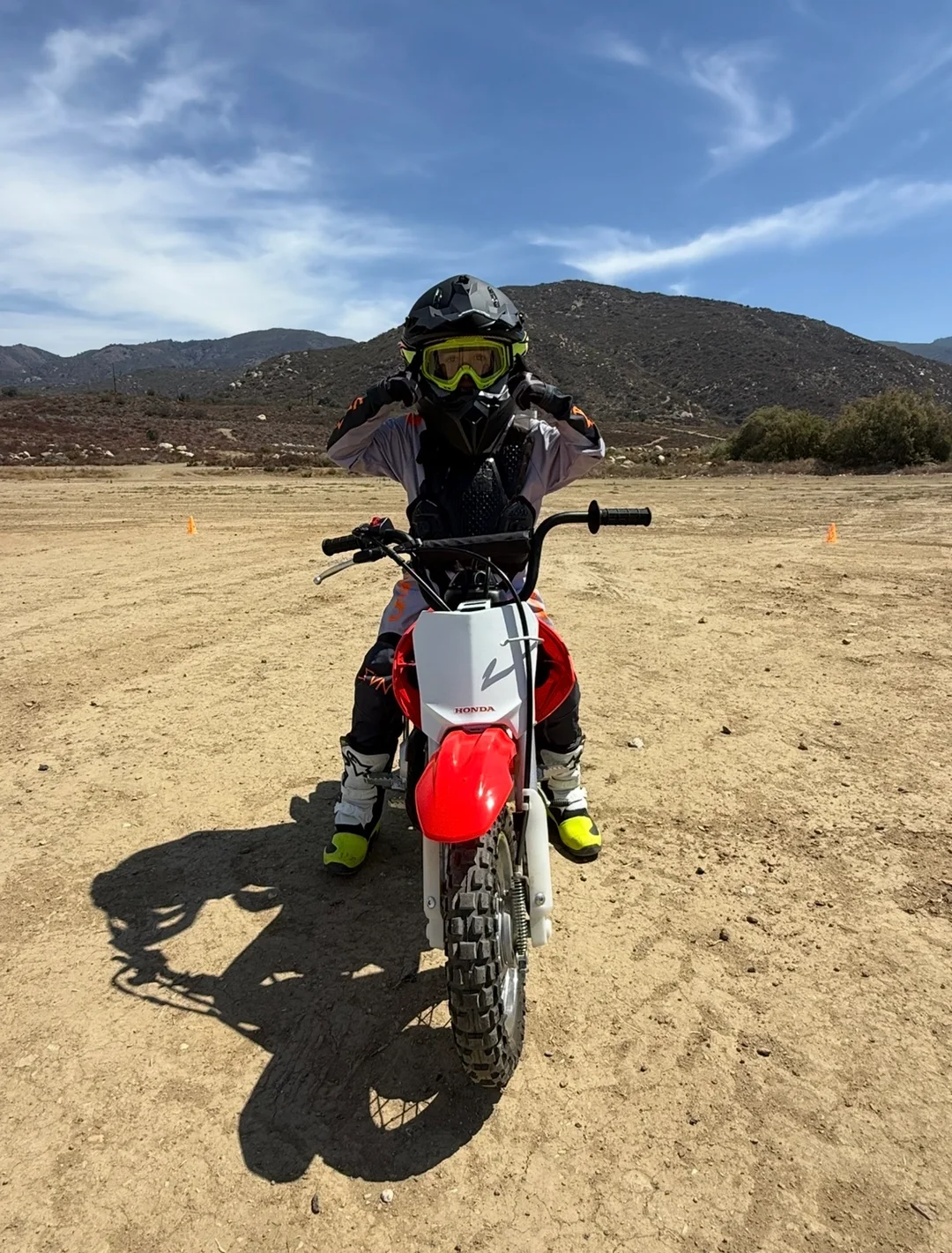 Young CMX rider wearing full protective gear on a Honda dirt bike