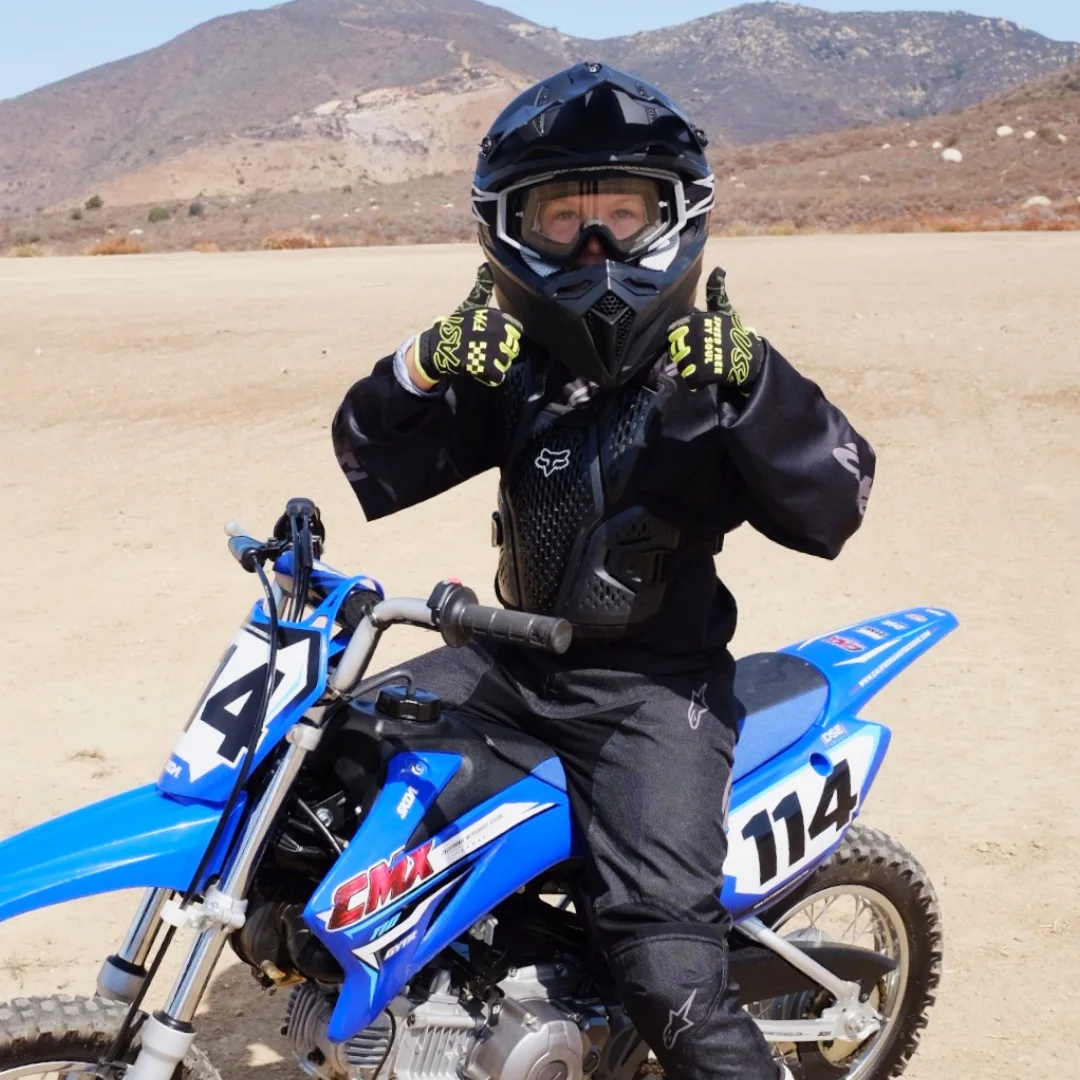 CMX student with a Yamaha dirt bike and protective equipment