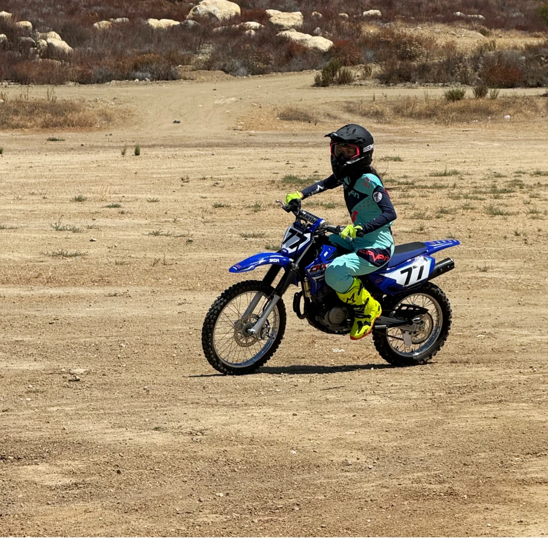 A CMX rider enjoying a day on a blue dirt bike